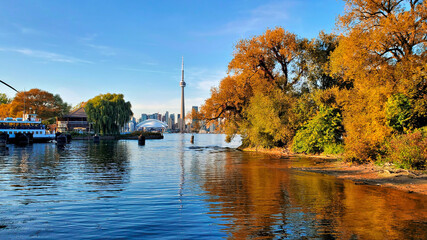 Toronto city skyline from the Toronto Islands during autumn with vibrant fall colors, Ontario, Canada