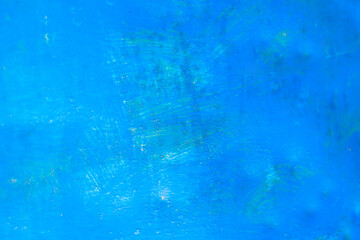 the blue surface of the paint on the wall