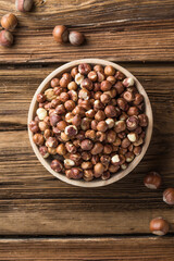 Full and peeled hazelnuts close-up. Macro photo of pile of filbert kernels