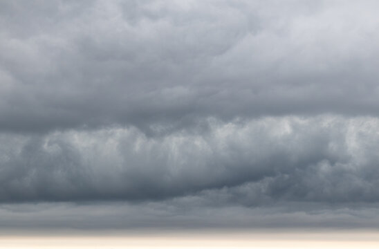 Sky replacement rolling gray and white dramatic storm clouds over horizon 7