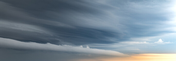 Fototapeta premium Sky replacement light arcus cloud over orange horizon