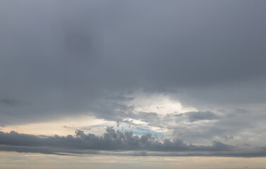 Sky replacement overhead distant dark clouds at sunrise