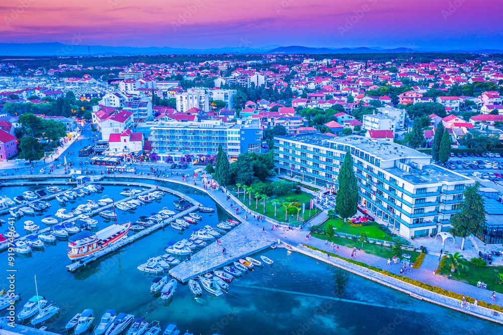 Wall mural evening sky over biograd town, riva view, croatia, europe.