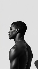Minimalist black and white portrait of a man in profile against a light background