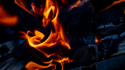 Dynamic Flames and Charcoal Glow A captivating depiction of heat and motion in nature