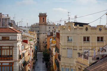 Valencia's Serrans street and Saint Bartolome Tower in summer