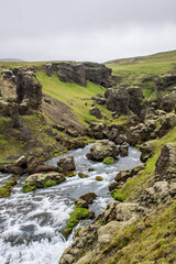 Skógafoss waterfall in Iceland on a cloudy summer day