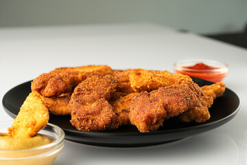 Crispy Chicken Strips with Spicy Mustard and Ketchup Sauces