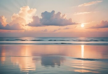 Obraz premium A serene ocean landscape with calm, rippling waves reflecting the warm, pastel-colored sky and bright sun in the distance