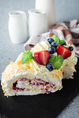 Delicate Meringue Roulade with Blueberries, Strawberries, and Mascarpone Cream