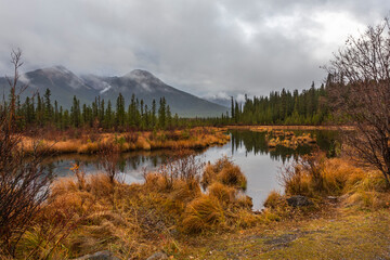 Fototapeta premium Breathtaking autumn landscape with mountains range over calm lake water. Location is Vermillion Lake in the Banff National Park, Alberta, Canada