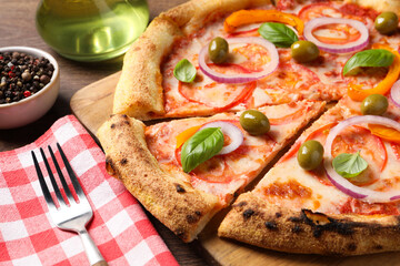 Delicious vegetarian pizza served on wooden table, closeup