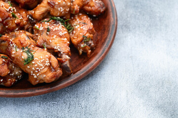 Caramelized in sause chicken wings  . Bar-b-q food background photo