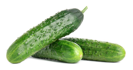 Three fresh green cucumbers isolated on white
