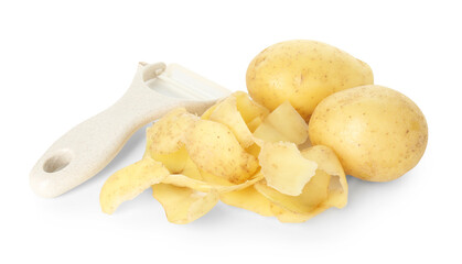 Young potatoes, peels and peeler isolated on white