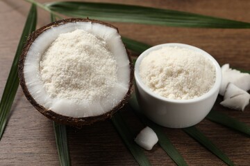 Coconut flour and leaf on wooden table, closeup