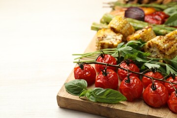 Delicious grilled vegetables with spices on white table, closeup. Space for text
