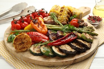Delicious grilled vegetables with spices on white table, closeup