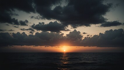 Obraz premium Dramatic Sunset Silhouette with Moody Sky Background