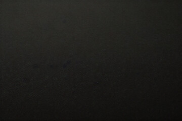 Seamless rough textured military, hunting or paintball camouflage pattern in a dark black and grey night palette. Tileable abstract contemporary classic camo fashion textile surface design texture	