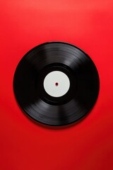 Black Vinyl Record on Red Surface