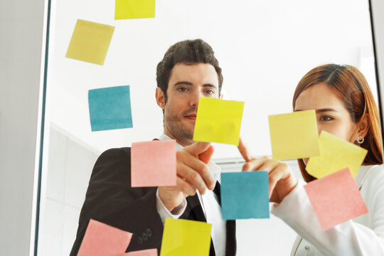 Creative Asian businesswoman in meeting workshop coming up with many positive ideas to help developing their corporate business. Group discussing and brainstorm concept. uds