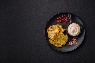 Vegetable zucchini fritters with garlic, salt, spices and herbs