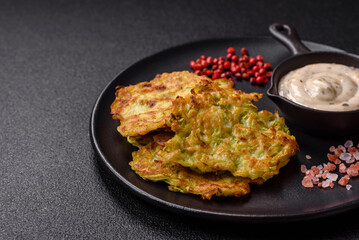 Vegetable zucchini fritters with garlic, salt, spices and herbs