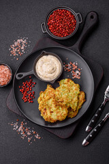 Vegetable zucchini fritters with garlic, salt, spices and herbs