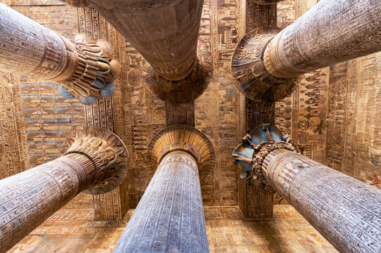 Colored columns and celling in the hypostyle hall of the Temple of Khnum at Esna . Luxor. Egypt.
