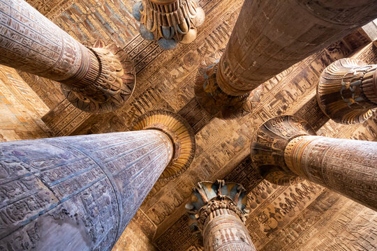 Colored columns and celling in the hypostyle hall of the Temple of Khnum at Esna . Luxor. Egypt.