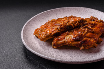 Delicious juicy grilled ribs with honey and mustard sauce with salt, spices and herbs