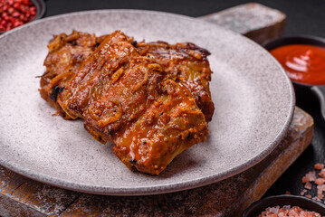 Delicious juicy grilled ribs with honey and mustard sauce with salt, spices and herbs