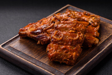 Delicious juicy grilled ribs with honey and mustard sauce with salt, spices and herbs