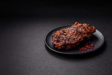 Fresh juicy delicious beef steak on a dark background