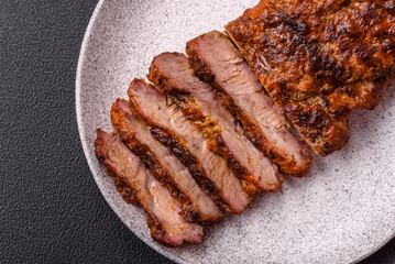 Fresh juicy delicious beef steak on a dark background