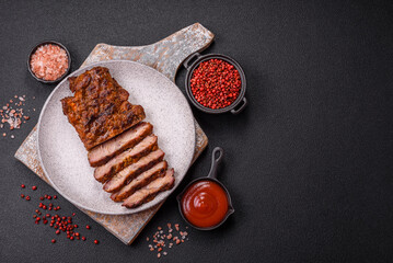 Fresh juicy delicious beef steak on a dark background