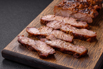 Fresh juicy delicious beef steak on a dark background