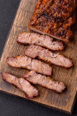 Fresh juicy delicious beef steak on a dark background