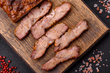 Fresh juicy delicious beef steak on a dark background