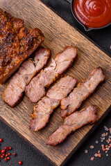 Fresh juicy delicious beef steak on a dark background