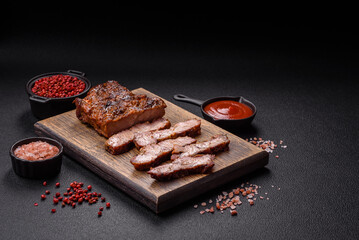 Fresh juicy delicious beef steak on a dark background