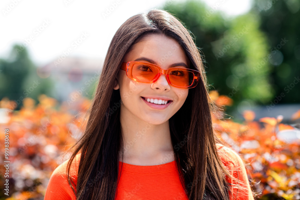 Sticker Photo of pretty teen good mood girl sunglass summer vacation wear red clothes walk outside urban city park