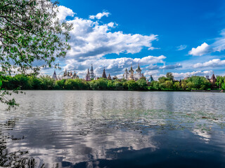 Admire the serene lake view with stunning reflections and lush greenery surrounding it