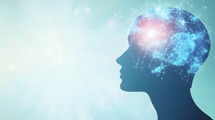 Obraz premium Silhouette of a human head with a glowing brain network against a soft blue background.
