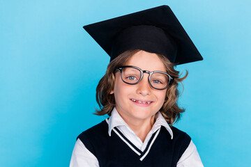 Photo of happy clever diligent boy wear uniform study primary school isolated on blue color background