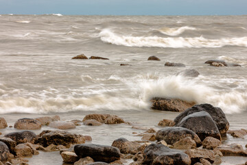 Rough waves of Lake Michigan pound the rocky shoreline of Harrington Beach State Park, Belgium, Wisconsin in late October.  The winds are caused by Hurricane Sandy that struck the east coast.