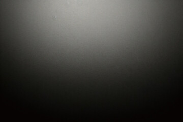 Black foil gradient texture background with uneven surface