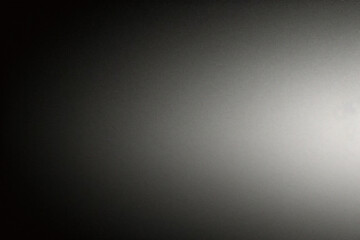 Black foil gradient texture background with uneven surface