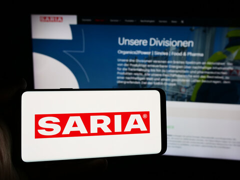 Stuttgart, Germany - 08-06-2024: Person holding smartphone with logo of German food service company Saria AS GmbH Co. KG in front of website. Focus on phone display.